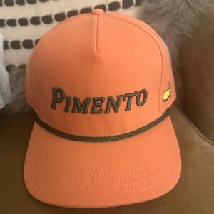 NWT Masters Orange “pimento” trucker hat. Unisex!